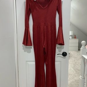 Jumpsuit.  Bell sleeves Stretchy fabric.